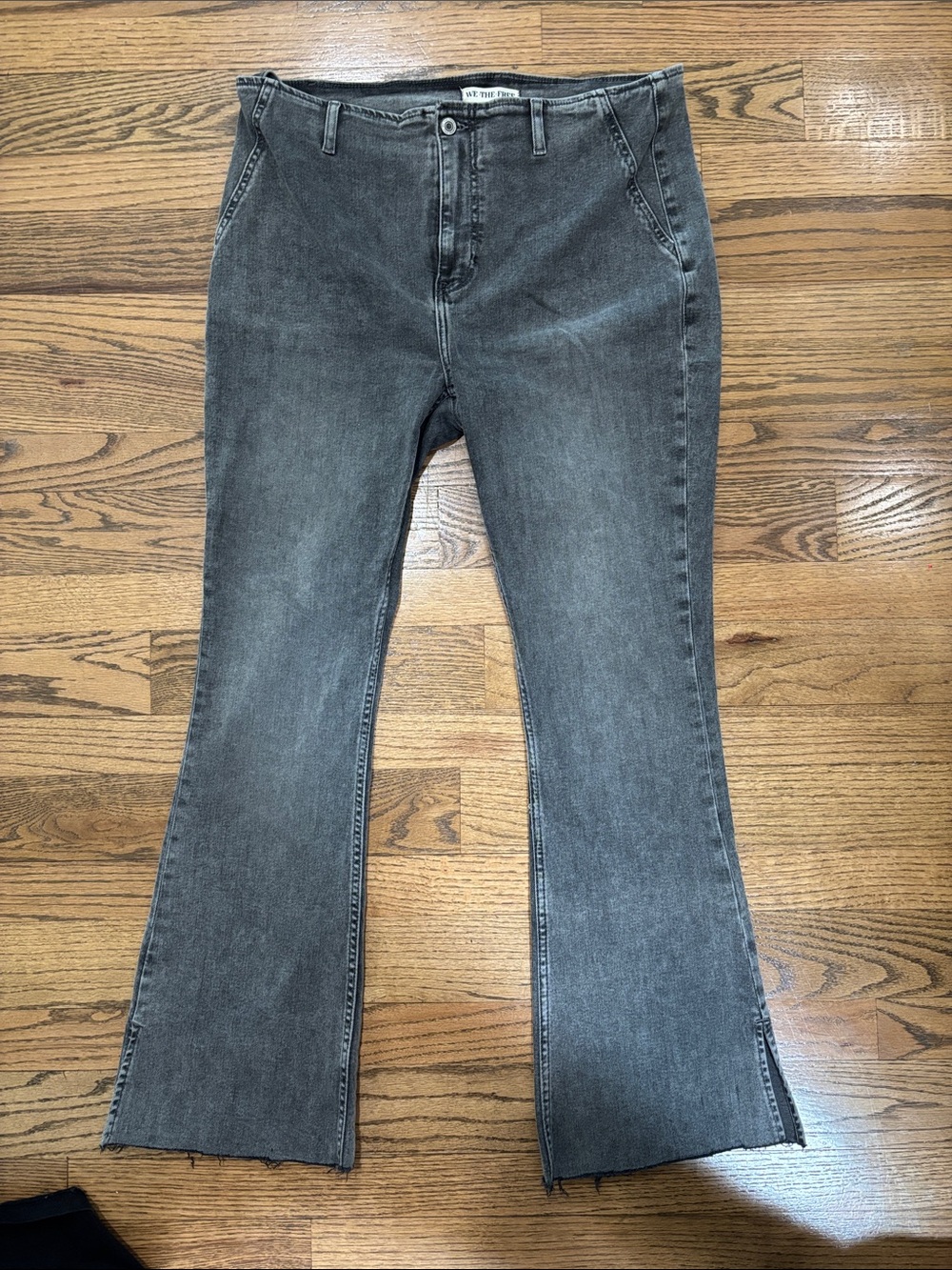 We The Free Black Wash Flare Jeans with Raw Hem